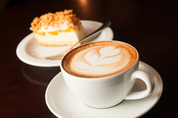 cappuccino cup with cake - obrazy, fototapety, plakaty