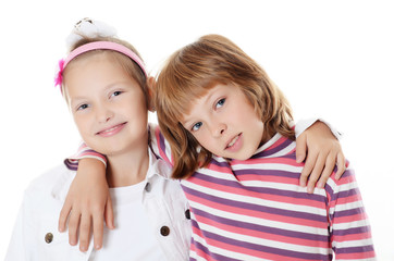 Two young girl friends on white background