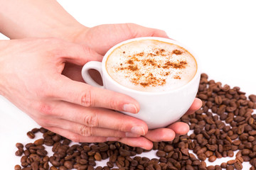 Hands holding a cup of coffee