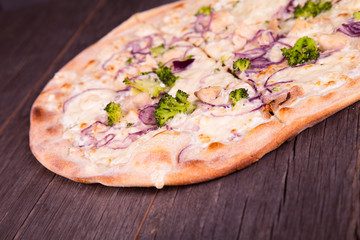 Delicious italian pizza served on wooden table 