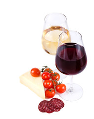 two wine glasses with red and white wine, cheese and tomato