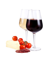two wine glasses with red and white wine, cheese and tomato