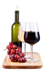 two wine glasses with red and white wine and bottle of wine