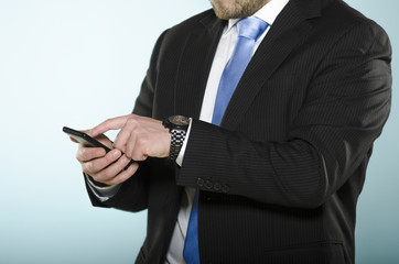 Businessman using smartphone.