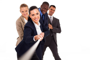 group of business people playing tug-of-war