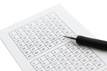 Lottery ticket and pen, isolated on white