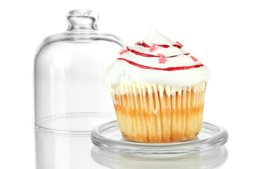 Cupcake on glass saucer, isolated on white