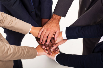 group of business people hands together forming teamwork