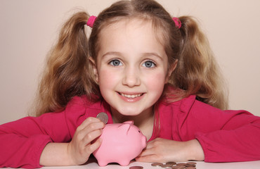 A little girl looks forward to saving her money