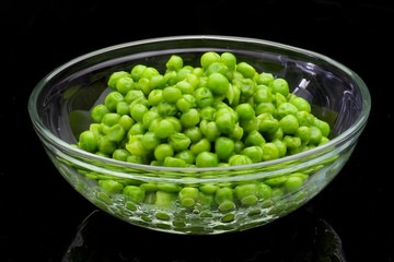 A bowl of cooked green peas