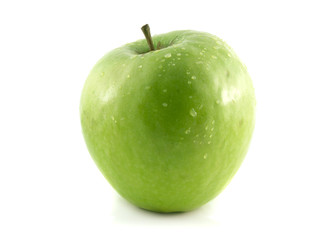 Isolated fresh green apple with waterdrops.