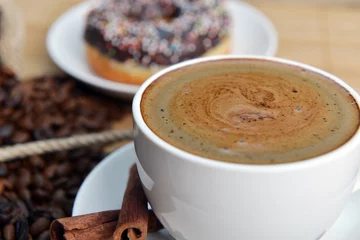 cup of coffee and sweet donut