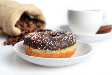 cup of coffee and sweet donut