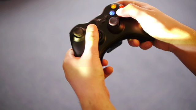 man's hands with wireless controller