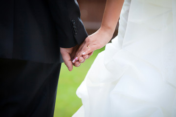 Young married couple holding hands