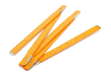 Folding wooden meter isolated on white background.