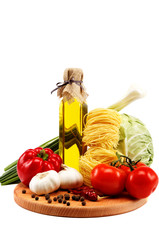 Fresh vegetables with olive oil isolated on white background.