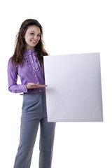 Fototapeta premium Gorgeous businesswoman pointing at a bord isolated on white