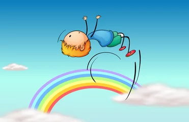 Foto op Aluminium Regenboog Een jongen die in de lucht springt en een regenboog