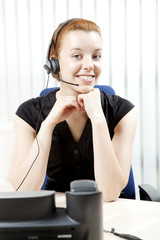 Naklejka premium Charming smiling woman with a headset