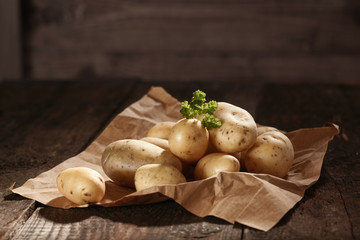Pile of fresh potatoes on brown paper