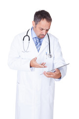 Portrait Of A Confident Doctor With Tablet