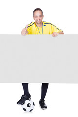 Happy Coach Holding Placard And Football