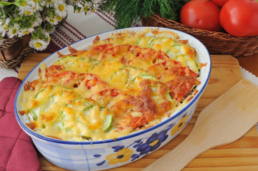 casserole of pasta with zucchini and tomato with cheese