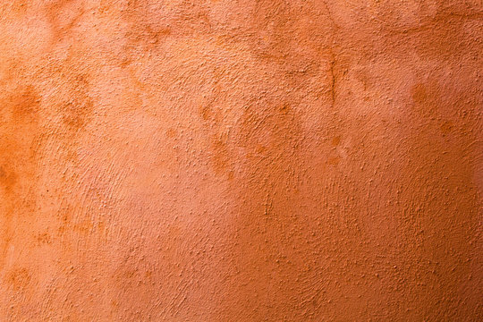 Textur von terrakottafarbenem Wandputz