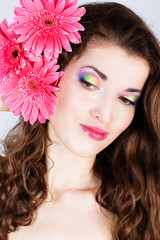 Fototapeta premium Girl with gerbera flower in studio