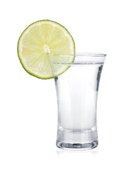 Shot of vodka and lime slice