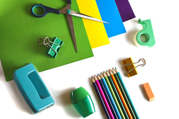 color paper, scissors, pencils, sharpener, puncher