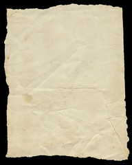 Old vintage torn creased paper isolated on black.