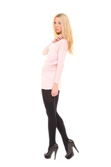 Fototapeta premium Beautiful slim model posing in studio, seen from behind