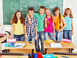 School child sitting in classroom.