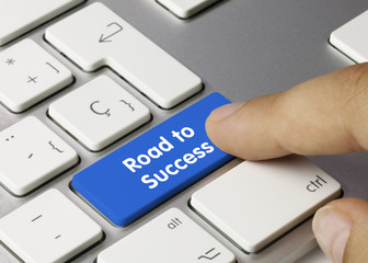 Road to Success keyboard key. Finger