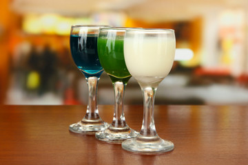 Tasty color liquors, on bright background