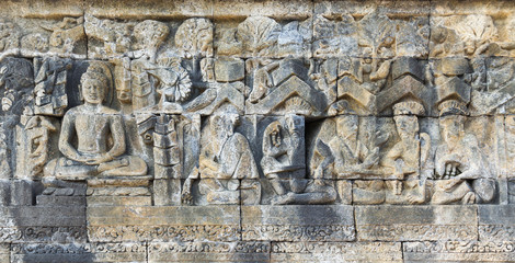 Buddha and men, bas relief carving.