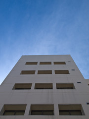 Facade windows of office building on blue sky