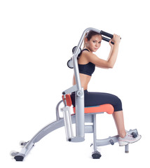 woman posing on orange hydraulic exerciser