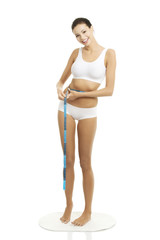 Attractive smiling woman with measurement type