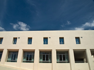 Facade windows of office building on blue sky