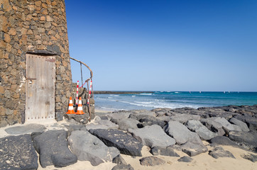 Lanzarote island beach with lighthouse building details