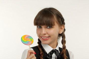 Smiling woman with lollipop