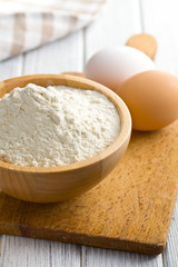Fototapeta na wymiar flour and eggs on kitchen table