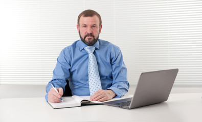 mature businessman at his office