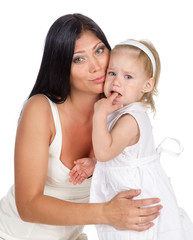 Mother comforting her crying little girl - parenthood concept