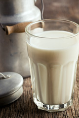 glass of milk on old wooden table