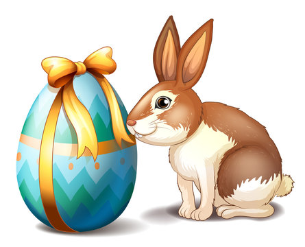 A rabbit and an Easter egg with a ribbon