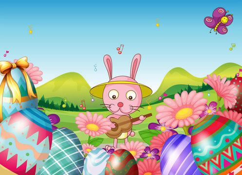 A bunny with a guitar and the easter eggs in the garden